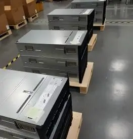 Multiple rack-mounted servers arranged on pallets showing the hardware units prepared for deployment.