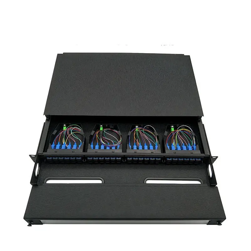 Open rack mounted fiber patch panel showing internal colored fiber routing, blue adapters, and front patch ports.