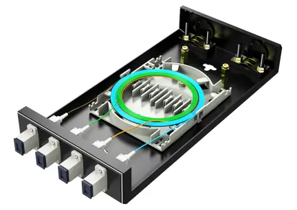 Open fiber splice tray shows front adapter ports, routed fibers, and a coiled fiber section inside the enclosure.