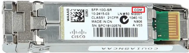 Close-up of an SFP-10G-SR module label with the COM marking highlighted for commercial-grade identification.